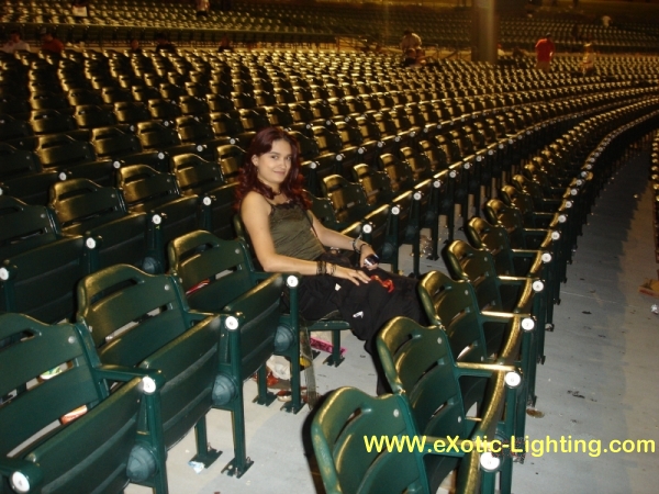Photo of empty, but glowing seats in an auditorium after a show where John Schlick was the Concert Lighting Designer.