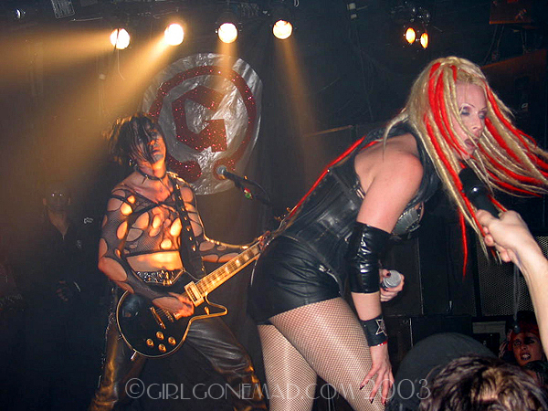 Photo of the Genitorturers at the Key Club in LA highliting Gen and Biz the guitar player.  John Schlick was the Lighting Designer for this show.
