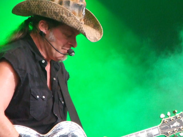 Photo of Gen of Ted Nugent at the Bospop festival in Germany that John Schlick was the Lighting Designer for.