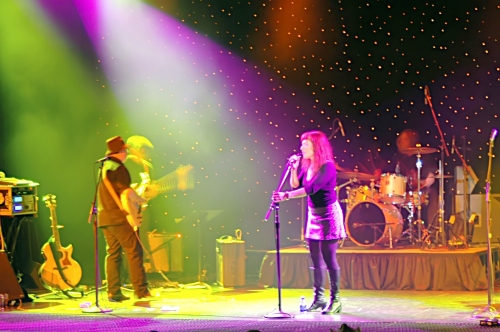 Two Loons for Tea: Shot of Sarah the lead singer surrounded by color.  John Schlick was the Lighting Designer for this show.