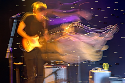 Shot of Two Loons for Tea guitar player - in a sea of waves.  John Schlick was the Lighting Designer for this show.
