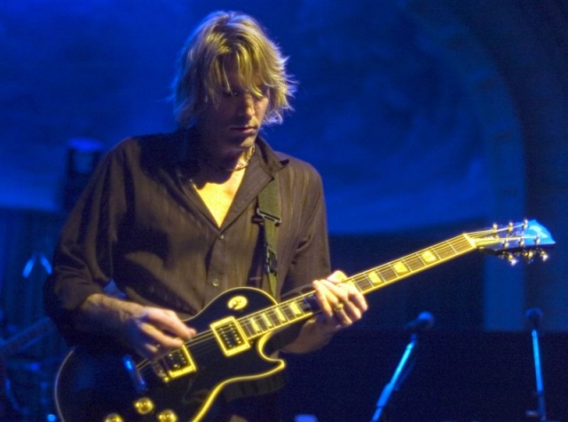 Photo of the Colorfield Stage Left Guitar Player taken at a show in Portland.  Lighting Designer: John Schlick