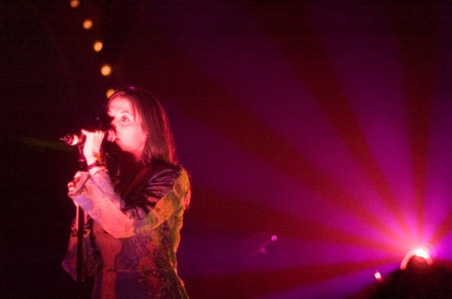 Photo of Colorfield's lead singer as she sits in a halo of light. John Schlick was the Lighting Designer.