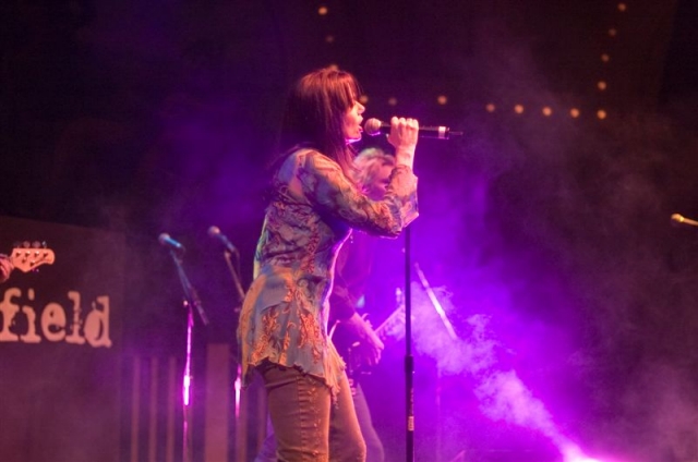 Photo of Colorfield's lead singer uplit in purple.  John Schlick was the Lighting Designer.