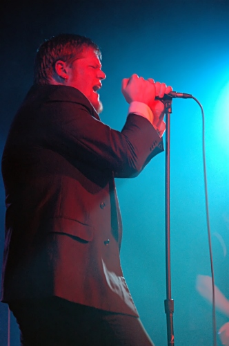 Shot of George of Counterfist colored red and framed in blue.  John Schlick was the Lighting Designer for this show.