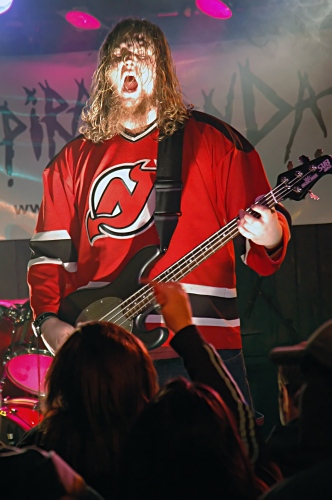 Shot of the Bass Player of Expiration Date: Doesn't he look like an evil zombie?.  John Schlick was the Lighting Designer for this show.