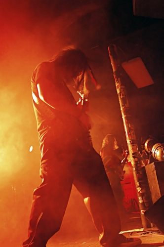 Shot of Mook, the guitar player for Expiration Date framed in red.  John Schlick was the Lighting Designer for this show.