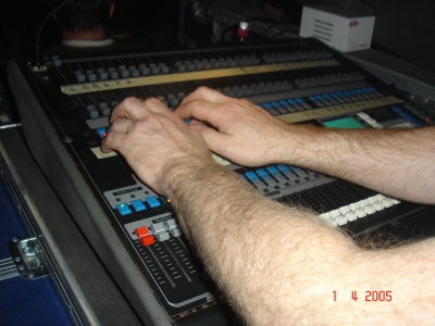 Photo of John Schlick the Concert Lighting Designer's hands running a show.