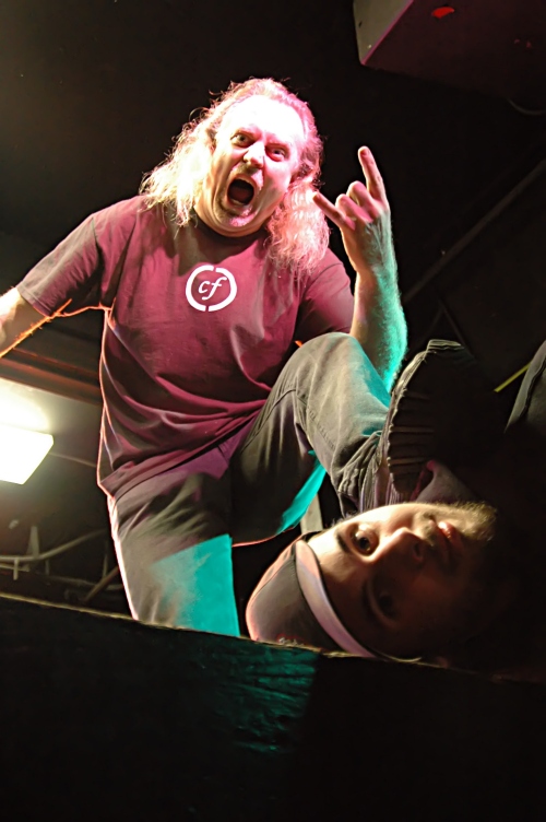 John Schlick: Lighting Designer kicking someone off the stage.