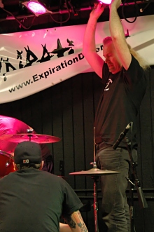 Photo of John Schlick: Lighting Designer focusing lights at a small show.