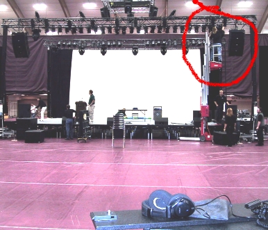 Photo of John Schlick the Concert Lighting Designer focusing lights at a show.