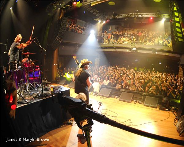 Photo of Ted Nugent At a House Of Blues with John Schlick at the lioghting consoles.  I was the Lighting Designer for this show.